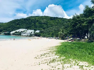 a beach with a bunch of people on it at Вилла с бассейном на Най Харн, 2 спальни G3 in Rawai Beach