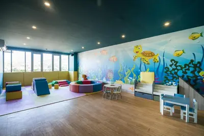 a room with a childrens play area with an ocean mural at Private apartment at Oceana Resort by Lofty in Kamala Beach