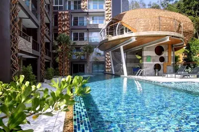 a swimming pool with a dome house on top of a building at Private apartment at Emerald Terrace in Patong Beach