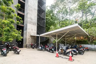 a group of motorcycles parked in front of a building at Private apartment at Emerald Terrace in Patong Beach