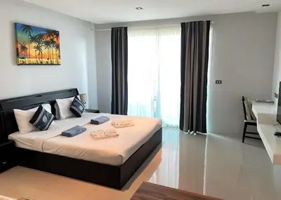 a bedroom with a large bed in a room at Private apartment at Emerald Terrace in Patong Beach