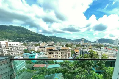 a view of a city from a balcony at Private apartment at Emerald Terrace in Patong Beach