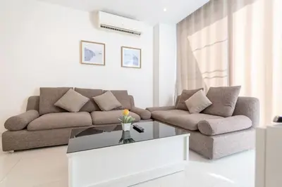 a living room with a couch and a coffee table at The Lago apartments 2bd in Phuket Town