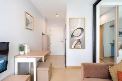 a living room with a couch and a table at Private apartment Zcape2 near Boat Avenue in Bang Tao Beach