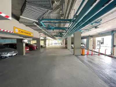 an empty parking garage with cars parked in it at Private apartment Zcape2 near Boat Avenue in Bang Tao Beach