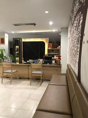 a waiting room with chairs and a reception desk at NAKA GUEST HOUSE in Ban Ko Kwang