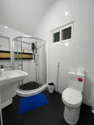 a bathroom with a shower and a toilet and a sink at Charming Villa Suite with Balcony near Beach in Patong Beach