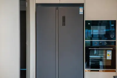 a stainless steel refrigerator and an oven in a kitchen at 5 Bdr 18 meter Pool villa in Laguna Phuket in Phuket Town