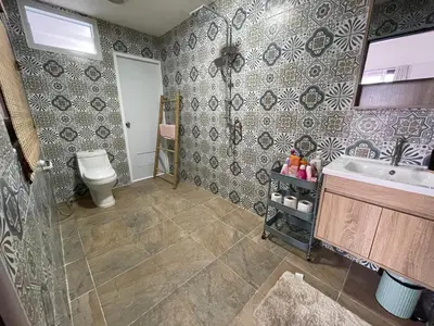 a bathroom with a sink and a toilet at Villa KEWALYN in Chalong