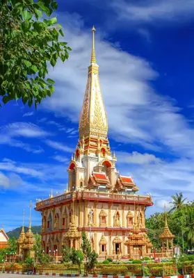 a building with a gold steeple on top of it at Villa KEWALYN in Chalong