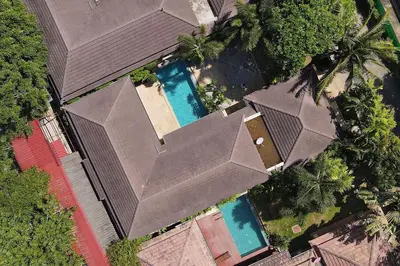 an overhead view of a house with two swimming pools at Tropical 3BR Pool Villa Prima, just 5min Drive to NaiHarn and Rawai Beach in Rawai Beach