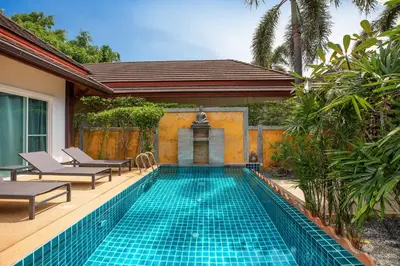 a swimming pool in a villa with a resort at Tropical 3BR Pool Villa Prima, just 5min Drive to NaiHarn and Rawai Beach in Rawai Beach