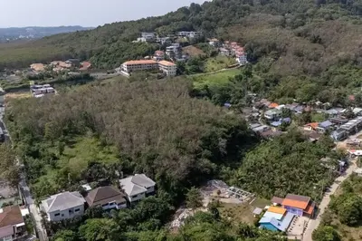 an aerial view of a town in a forest at Ray Ray Villa by G Estate Phuket in Kata Beach
