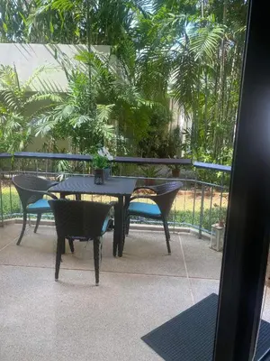 a black table and chairs sitting on a patio at Dewa One bedroom suite in Nai Yang Beach