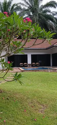 a building with benches in front of a yard at Wow !! Super Cool !! Jungle View Pool Villa !! Krabi - Thailand in Krabi town