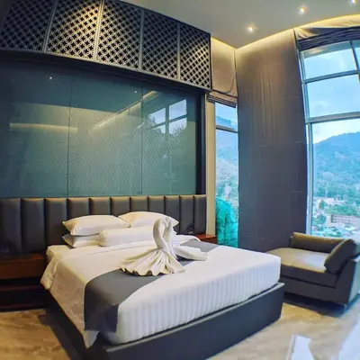 a bedroom with a large bed with a large window at 360* Ultimate Penthouse Entire TOP FLOOR and RESORT with GREAT AMENITIES in Kamala Beach
