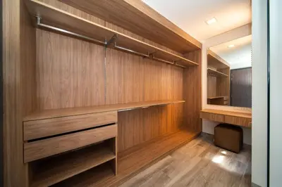 a walk in closet with wooden walls and wooden floors at 4bdr pool villa in Laguna Park 2 in Phuket Town