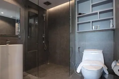a bathroom with a shower and a toilet and a sink at Tropics Kamala Hill View Apartment CTG D709, near Beach and Fantasea in Kamala Beach