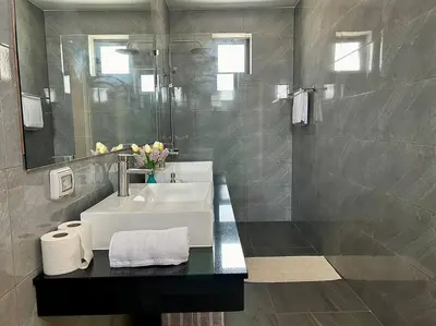 a bathroom with a sink and a mirror at Costa Lota villa, brand new, 3 bedroom, in rawai V35 in Rawai Beach