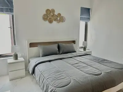 a bedroom with a large bed and two lamps at Costa Lota villa, brand new, 3 bedroom, in rawai V35 in Rawai Beach