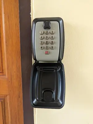 a cell phone is attached to a door at Rawai-Casevacanze in Rawai Beach