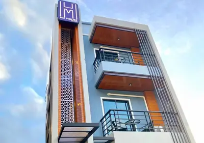 a building with balconies on the side of it at Hm House Patong in Patong Beach