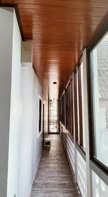 a hallway of a house with a wooden ceiling at Hm House Patong in Patong Beach