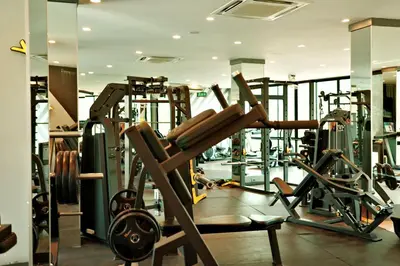 a gym with a bunch of equipment in a room at City Gate Kamala D305 by Phuket Sabay Rent in Phuket Town