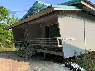 a side view of a house with a porch at Firdous Guesthouse in Ko Yao Yai