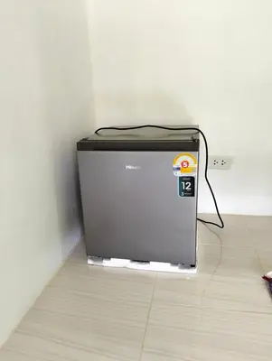 a small television sitting on the floor in a room at Firdous Guesthouse in Ko Yao Yai