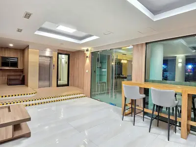 a conference room with two chairs and a table at Sira Boutique, Patong in Patong Beach