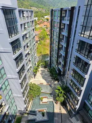 an aerial view of two tall apartment buildings at Stylish apartments Kamala CityGate in Kamala Beach