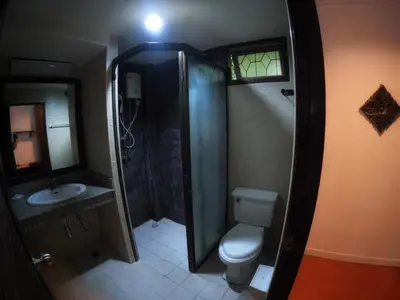 a bathroom with a shower and a toilet and a sink at the hill resort \u5e0c\u5c14\u5ea6\u5047\u5c4b in Patong Beach