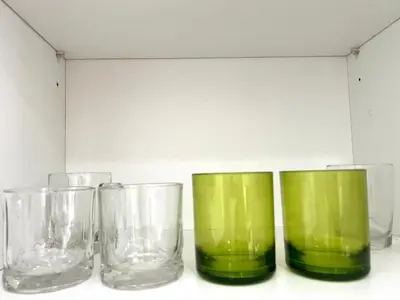 four glass vases sitting next to each other on a table at Modern style 1BR Condo close to Kata beach in Kata Beach