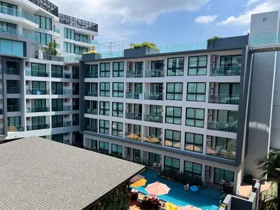 an aerial view of a building with a swimming pool at Modern style 1BR Condo close to Kata beach in Kata Beach