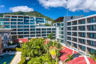 an aerial view of a resort with palm trees at Modern style 1BR Condo close to Kata beach in Kata Beach
