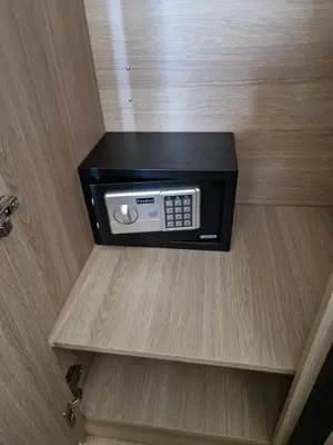 a microwave on a shelf in a hotel room at Bonanza Patong Beach1 100m to Beach Sun Room in Patong Beach
