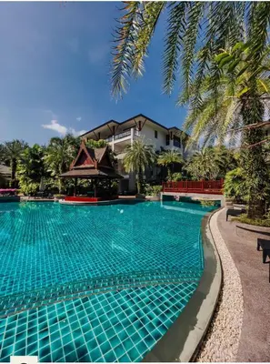 a swimming pool in front of a resort at Pearl of naithon two 2 bedrooms in Nai Thon Beach