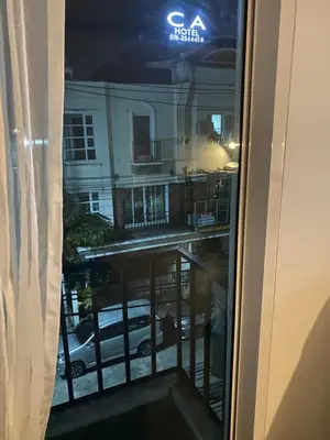 a view of a building from a window at Superb Apartment in Ban Na Khua