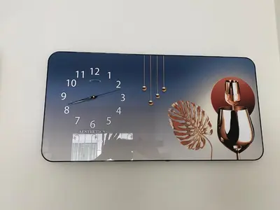 a clock is hanging on a wall with a clock at Superb Apartment in Ban Na Khua