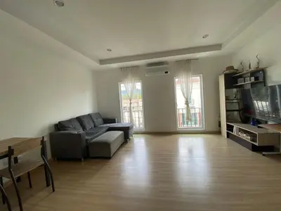 a living room with a couch and a table at Superb Apartment in Ban Na Khua