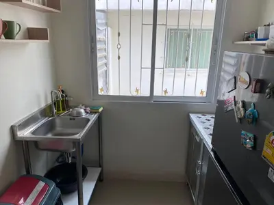 a small kitchen with a sink and a window at Superb Apartment in Ban Na Khua