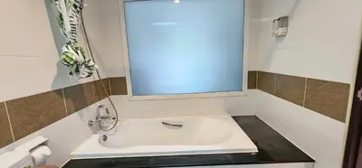 a bathroom with a sink and a mirror at Diamond Crown Hotel in Patong Beach