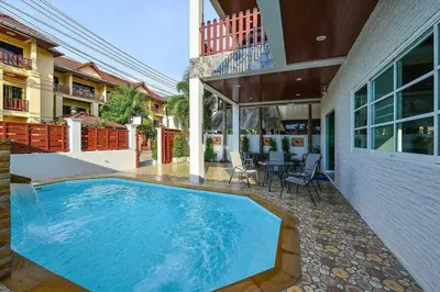 a swimming pool in the backyard of a house at Group Getaway Patong House in Patong Beach
