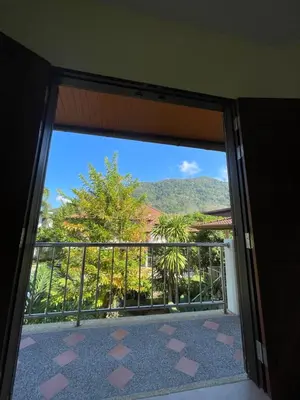 an open door to a balcony with a view at Natures relax in Kamala Beach