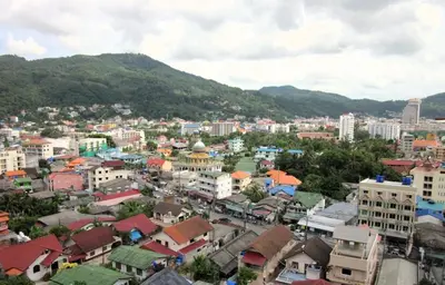a city with buildings and mountains in the background at Sea view apartment at The Unity by Lofty in Patong Beach