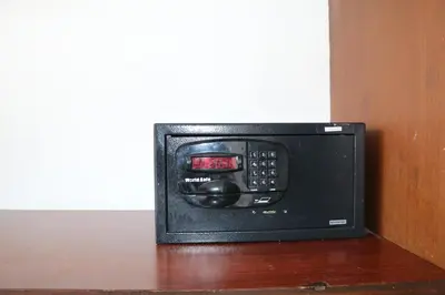 a microwave oven sitting on top of a wooden table at Diamond Crown in Patong Beach