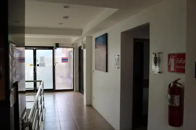 a hallway with a door and a fire hydrant at Diamond Crown in Patong Beach