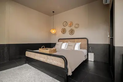 a bedroom with a bed with a basket on it at Marococco Private Pool Villa in Ban Mut Dok Khao