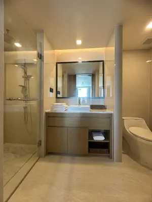 a bathroom with a sink and a toilet and a mirror at Apartment in 5 hotel with sea view and waterpark in Rawai Beach